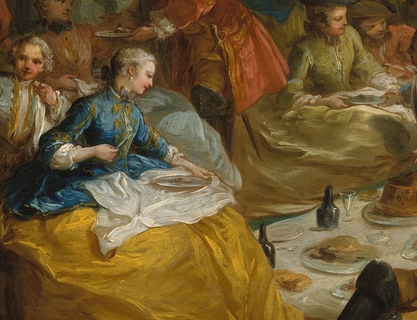 The ritual object: wine, glassware, provisions on a white cloth.