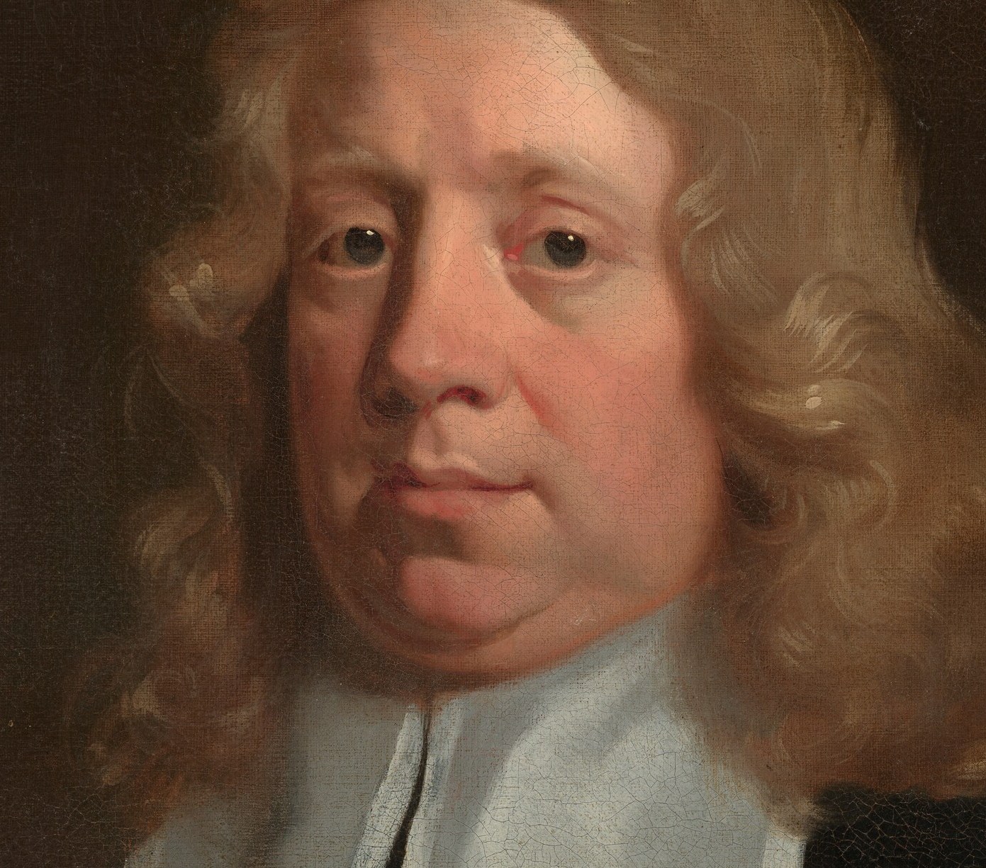His long, curled hair was the height of fashion for a man of status.