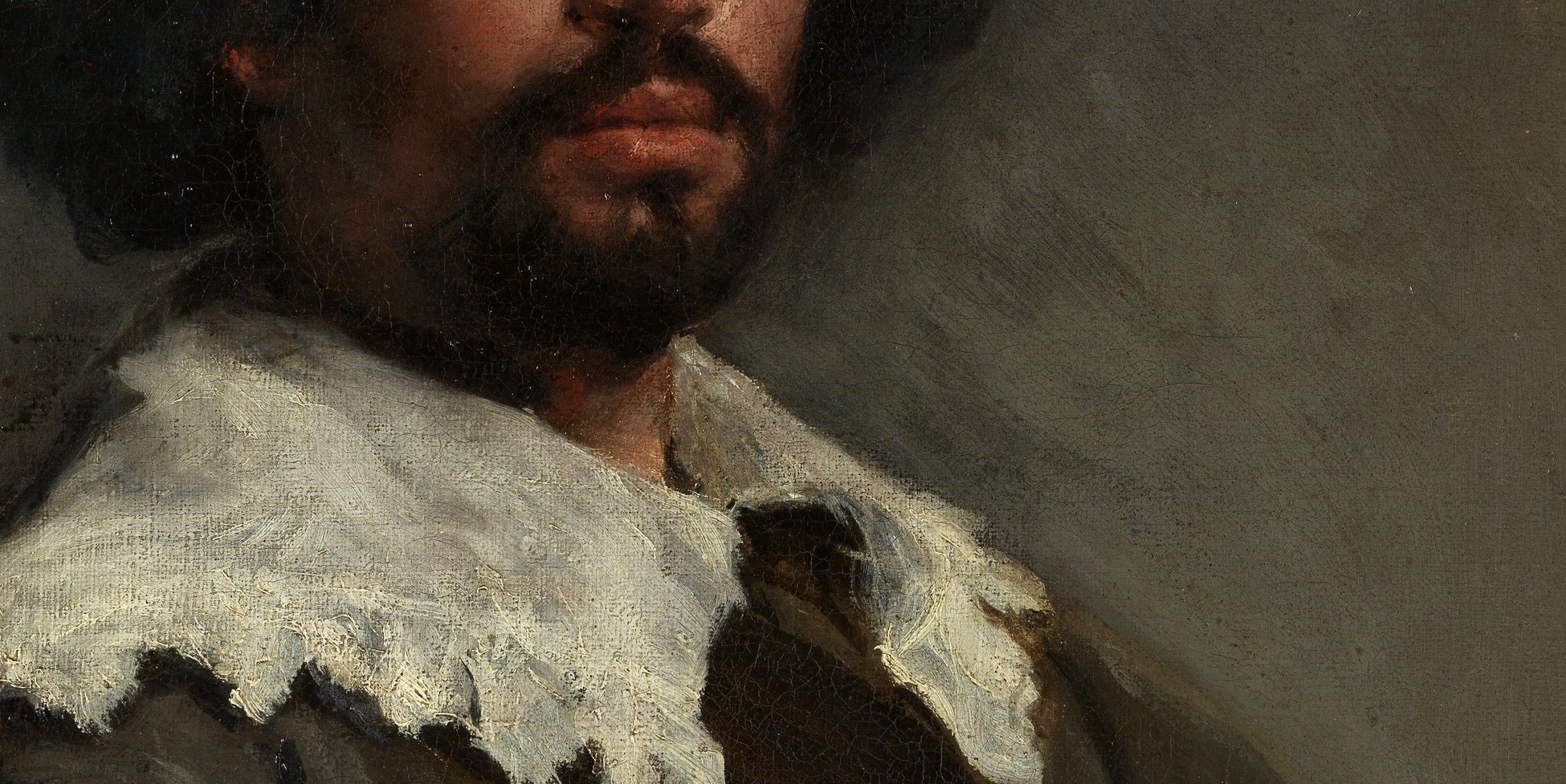 The collar is painted in sharp white lace. A status symbol, on a man who was enslaved.