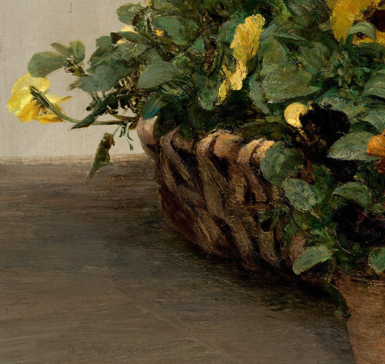 The only non-terracotta container; its rough organic texture contrasts with the smooth clay pots and anchors the left edge with warmth.