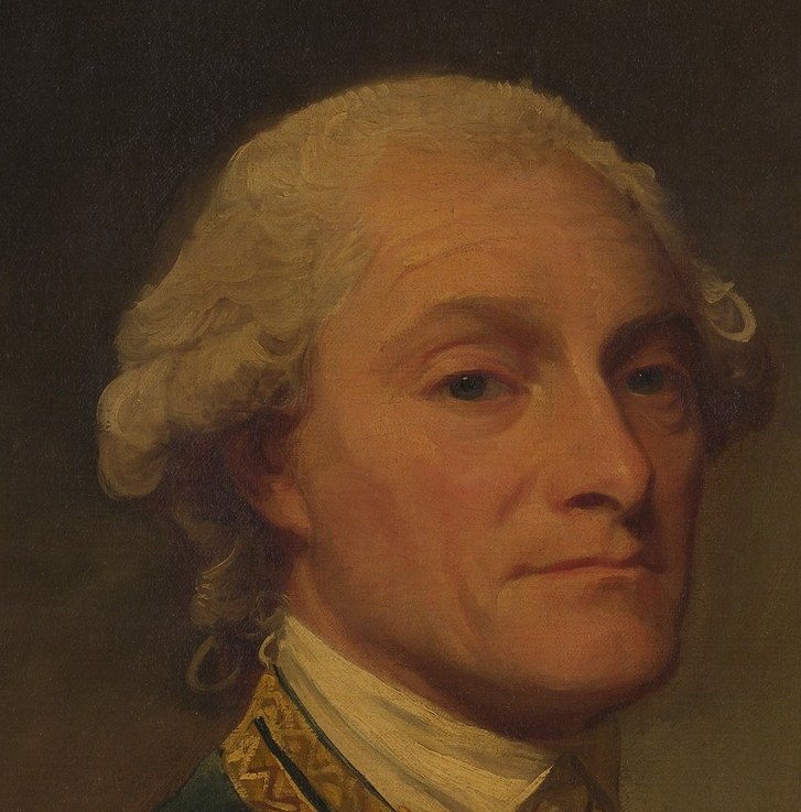 His direct gaze and slightly furrowed brow convey a sense of authority and perhaps weariness.