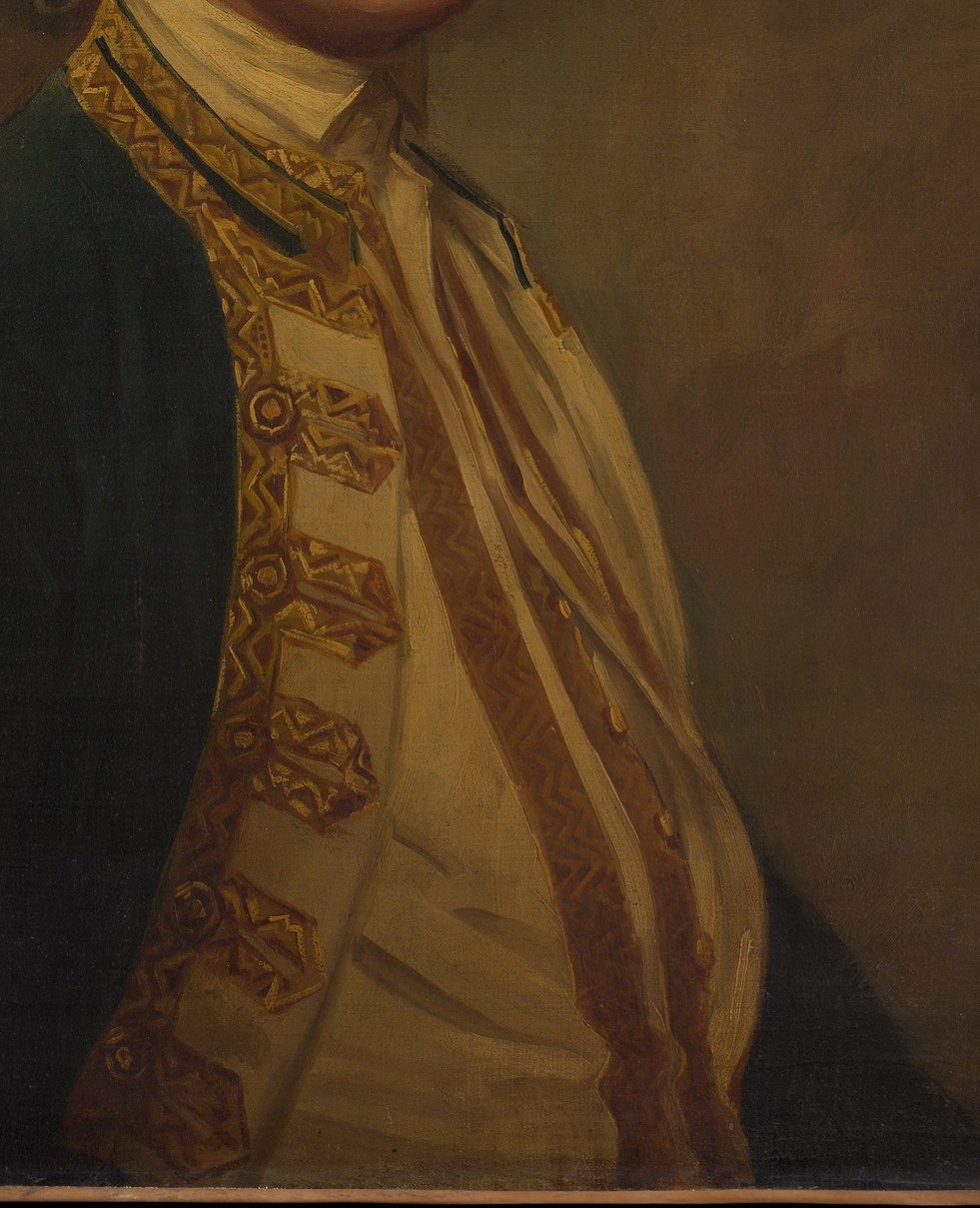 His gold vest signals immense status.