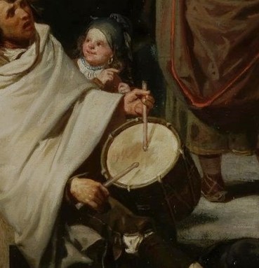 The rhythm starts with this seated drummer.