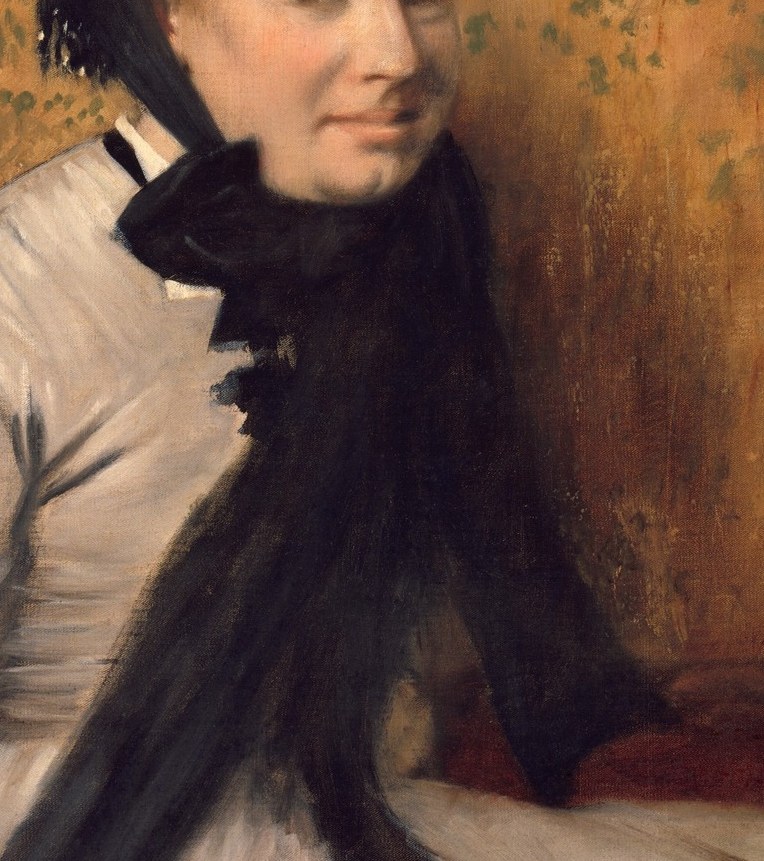 The dark, flowing fabric contrasts sharply with her dress, adding depth and a sense of elegant melancholy.