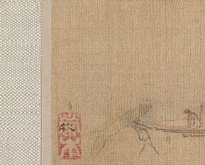 An ox-cart moves through a mountain pass.