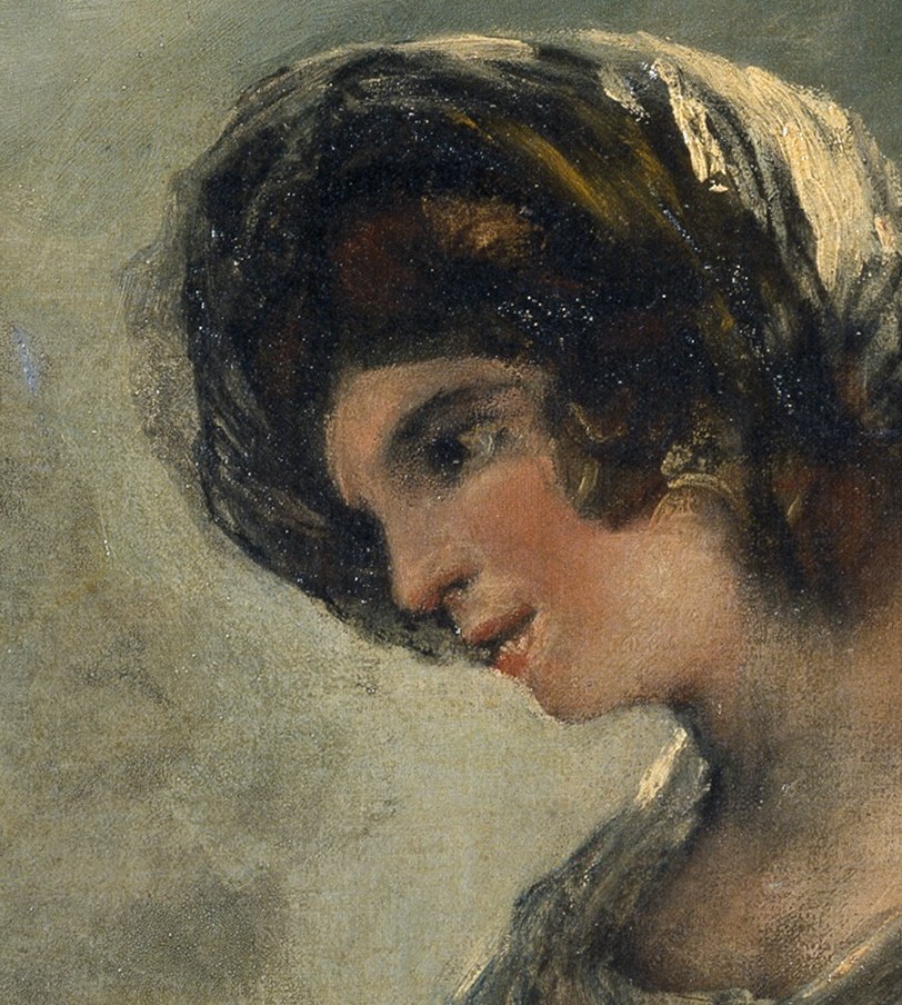 She looks away, lost in thought.