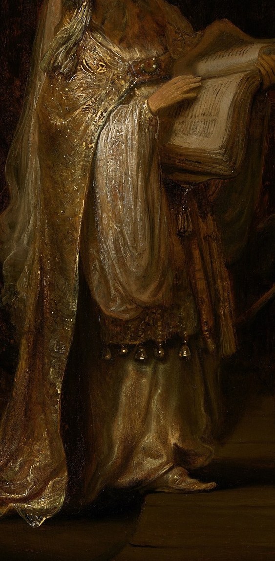 Look closely at the rich costume of the old priest.