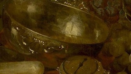 The silver bowl reflects everything around it.