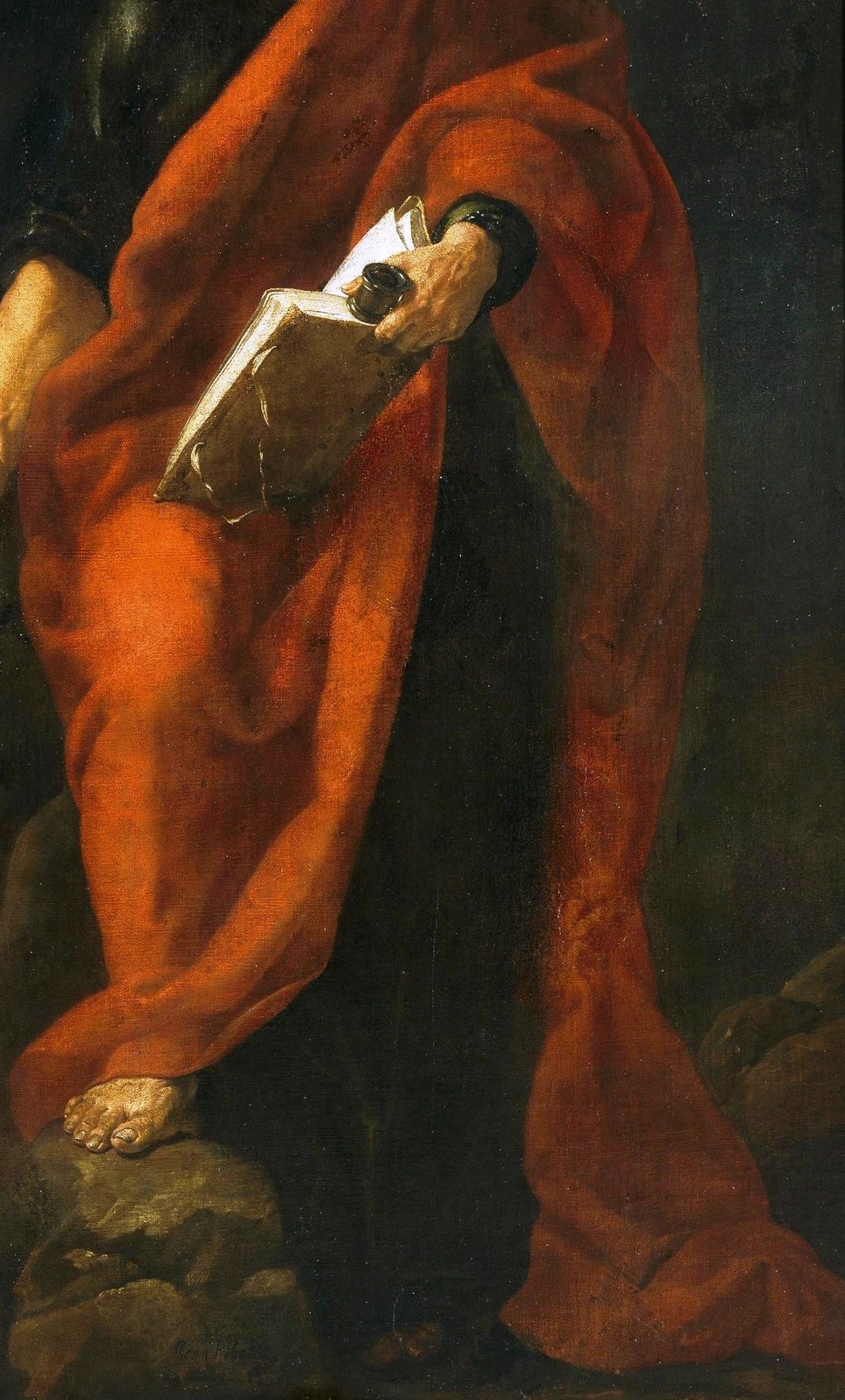 The vibrant red robe glows against the darkness.