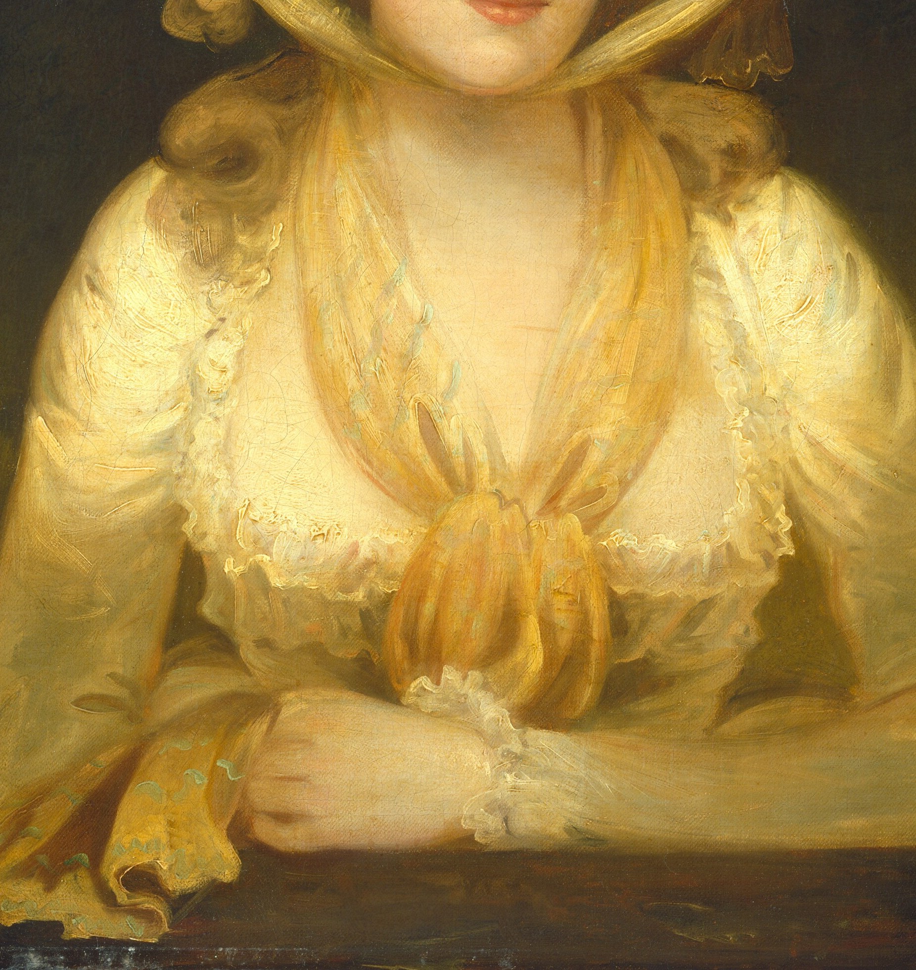 Look closely at her luminous cream silk dress.