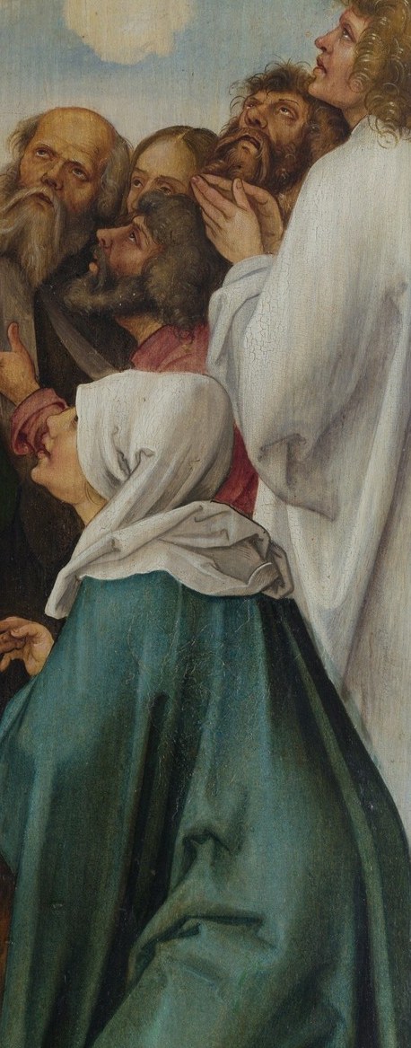 Now look at the woman in the white veil.