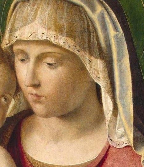 Look at the mother's face, serene but with a hint of sorrow.