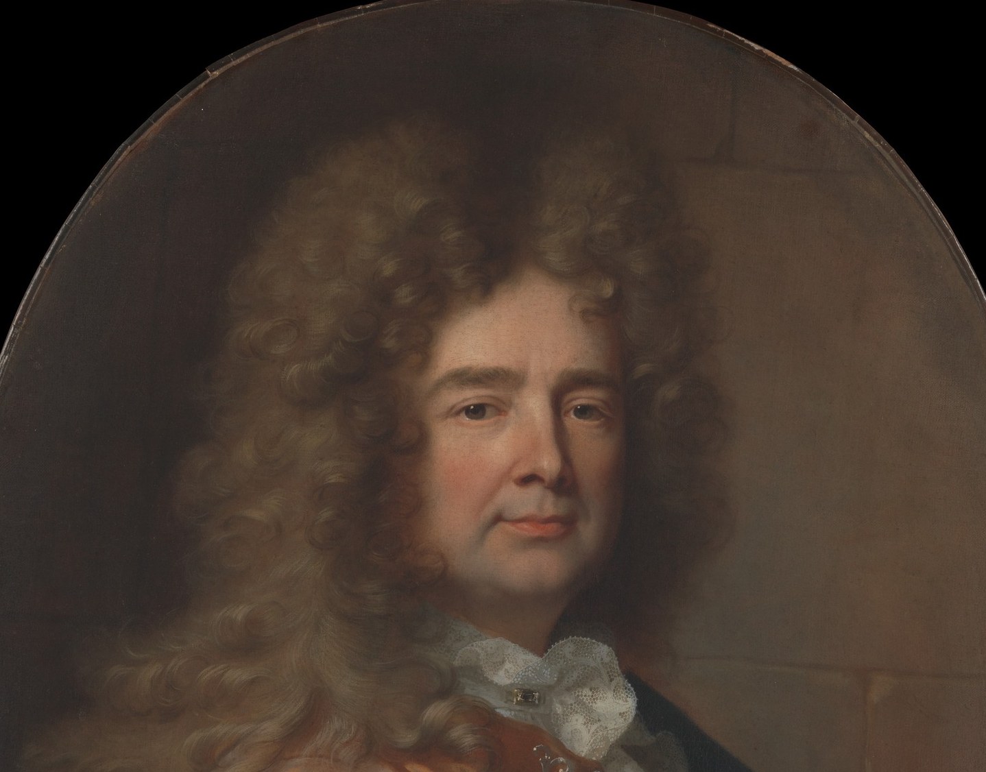 The wig nearly doubles the apparent head width and dominates the upper canvas , it is itself a status signifier, placing the sitter firmly in the court culture of Louis XIV's France.