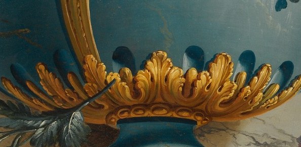 The intricate gold work adds a touch of luxury and highlights the vase's form.