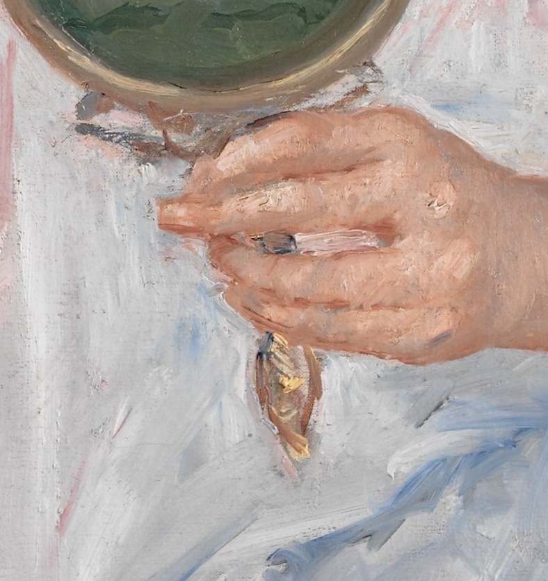 This woman, Denise, looks into a small hand mirror.