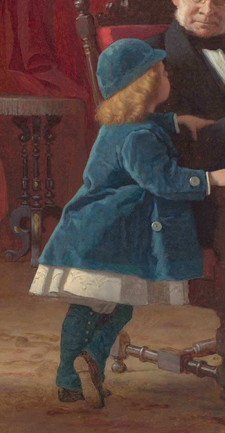 The boy in blue looks up at him, a natural connection.
