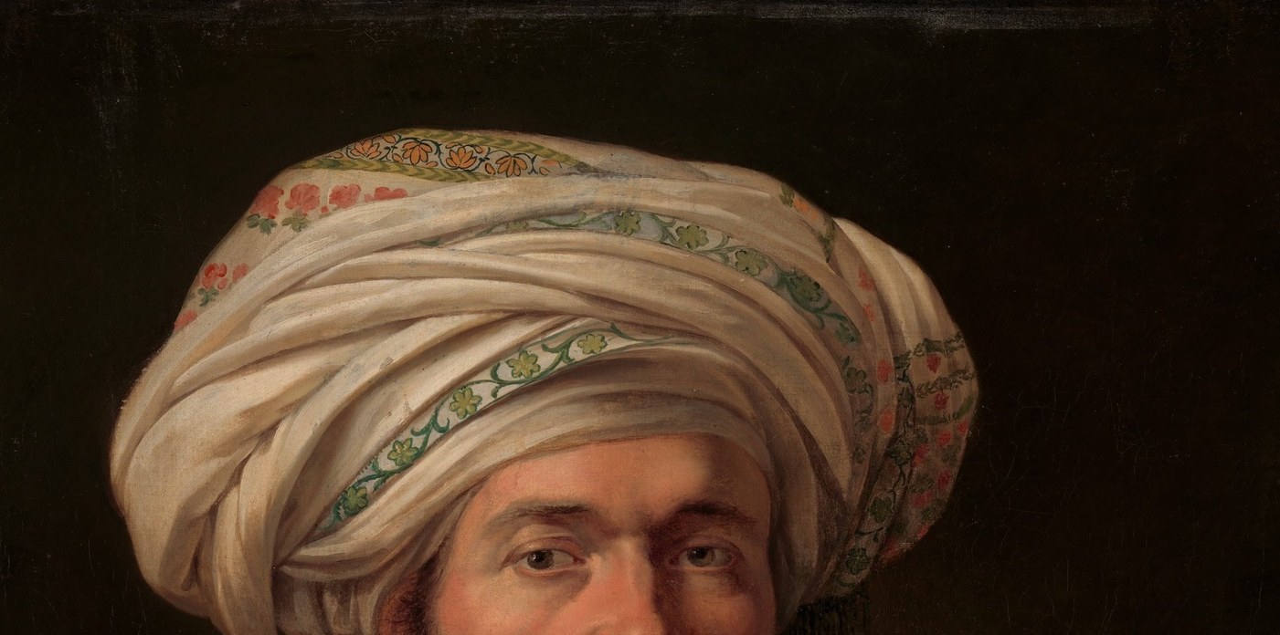 A monumental cloth construction that signals rank and non-European identity; the complex winding technique and light-catching folds are the painting's most theatrical surface.