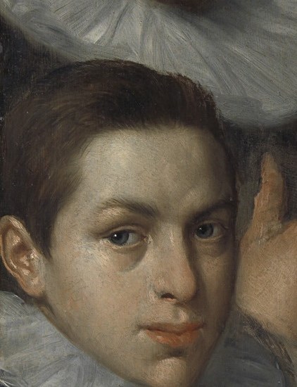 Even his young son looks out, part of the family workshop.