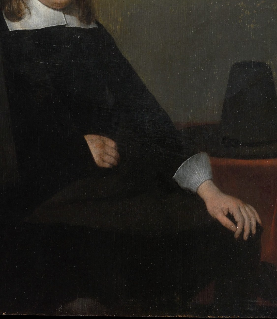 The deep, rich black of the coat, rendered with subtle variations in tone, emphasizes the subject's gravitas.