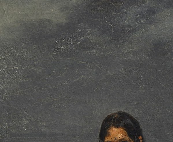 Her expression is direct, unsentimental. She is not a curiosity.