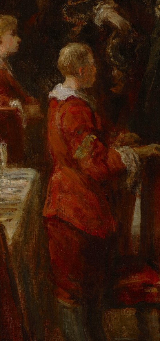 His placement at the table suggests he is a guest, and his attire adds a splash of color to the scene.