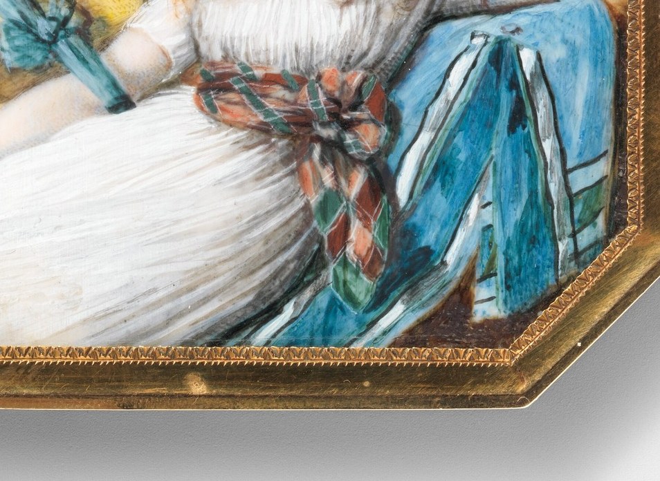 Her red hair and white dress are painted on ivory.