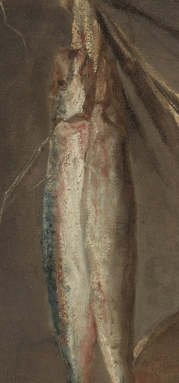 Two glistening herrings hang, ripe for the table.