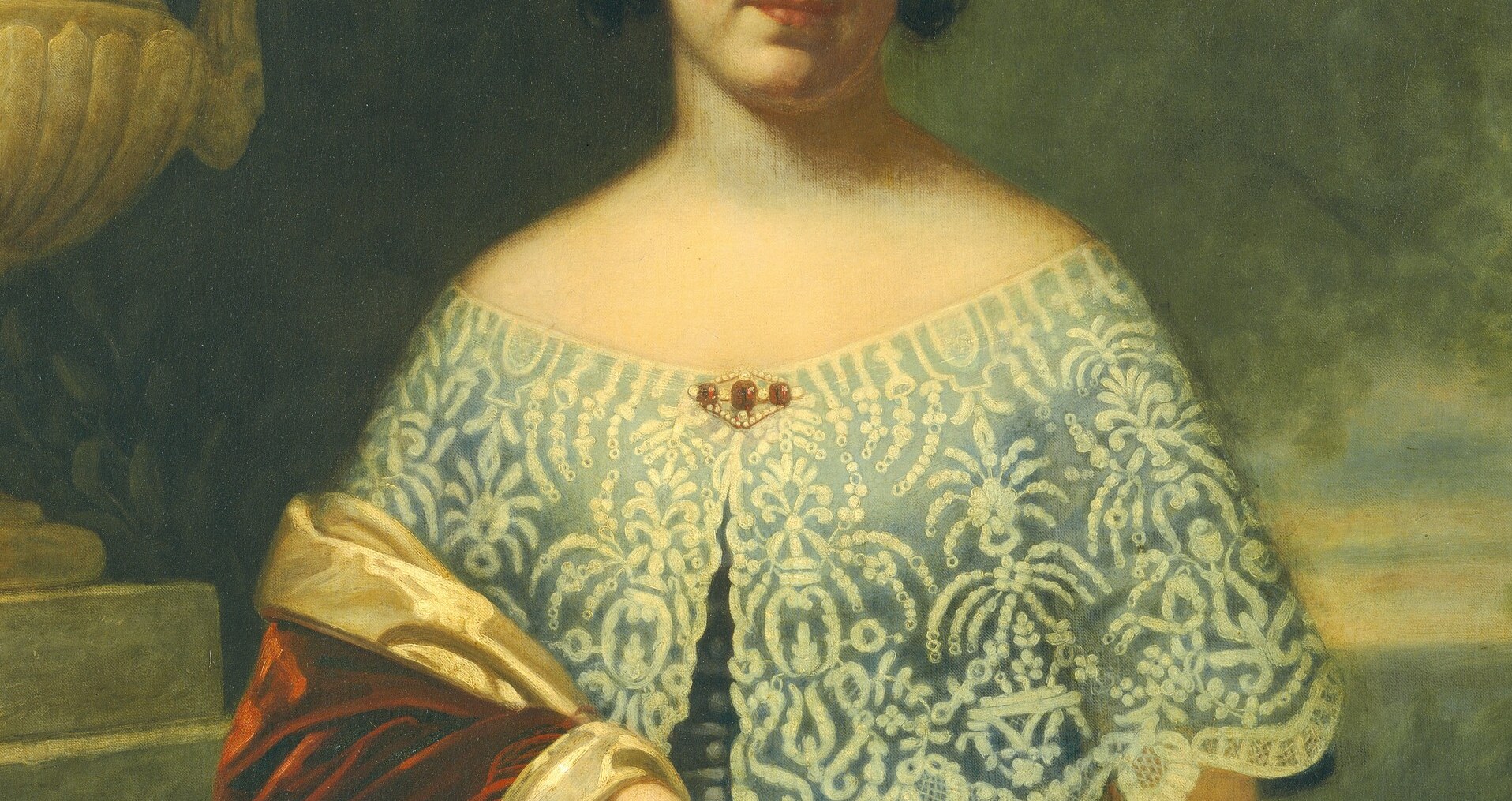 The densely worked lace is a status display and a technical showpiece; its whiteness frames the face and catches the most light in the composition.