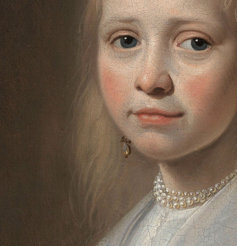 Her direct gaze and slightly parted lips create an engaging and almost conversational presence.