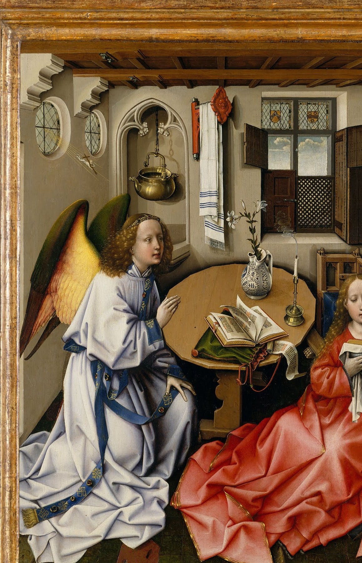 The angel's dynamic entrance and brilliant plumage define the painting's drama , its posture communicates deference before the sacred.