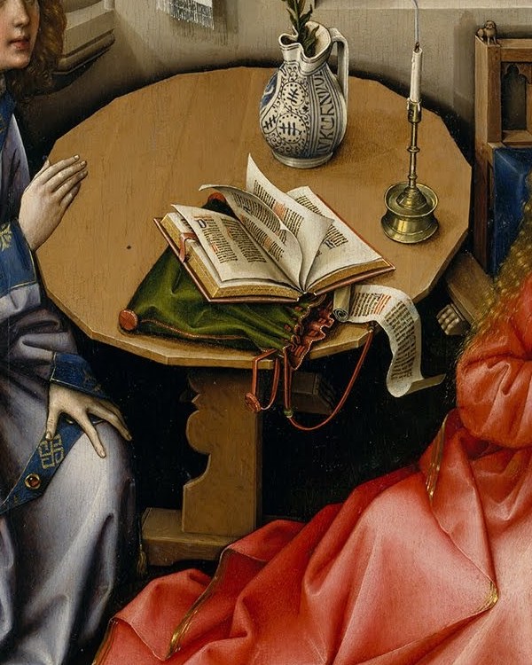 A candle on her table has just been snuffed out.