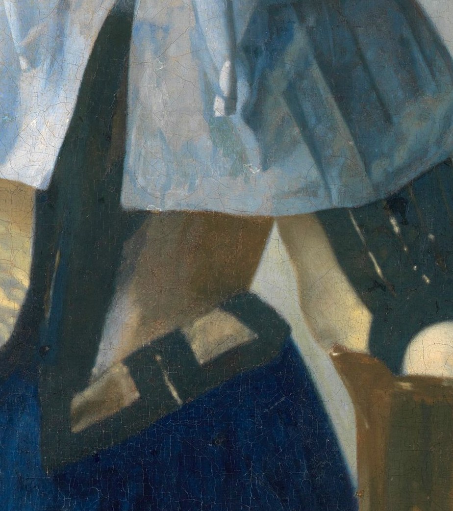 The jug's gleaming surface demonstrates Vermeer's mastery of metallic reflection; in Dutch iconography a water jug signals cleanliness and feminine virtue.