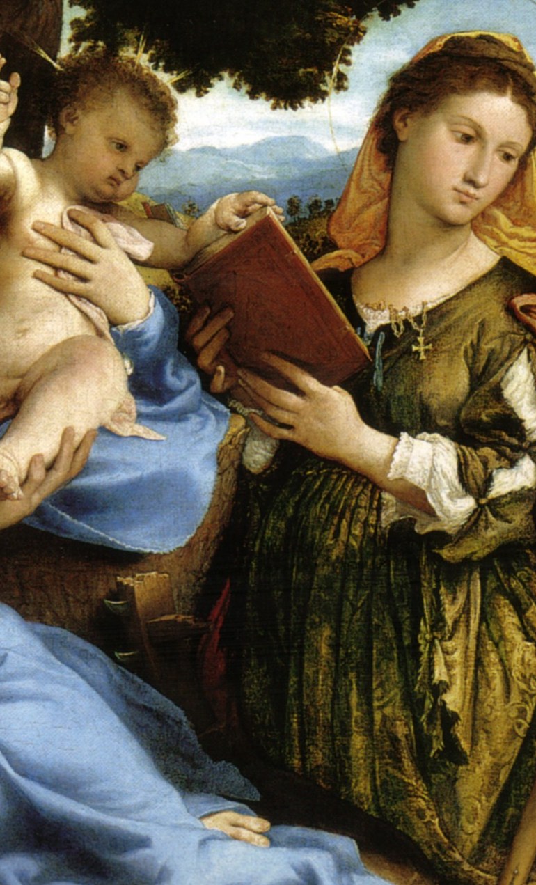 Her focused expression and the book suggest her intellectual and spiritual depth.