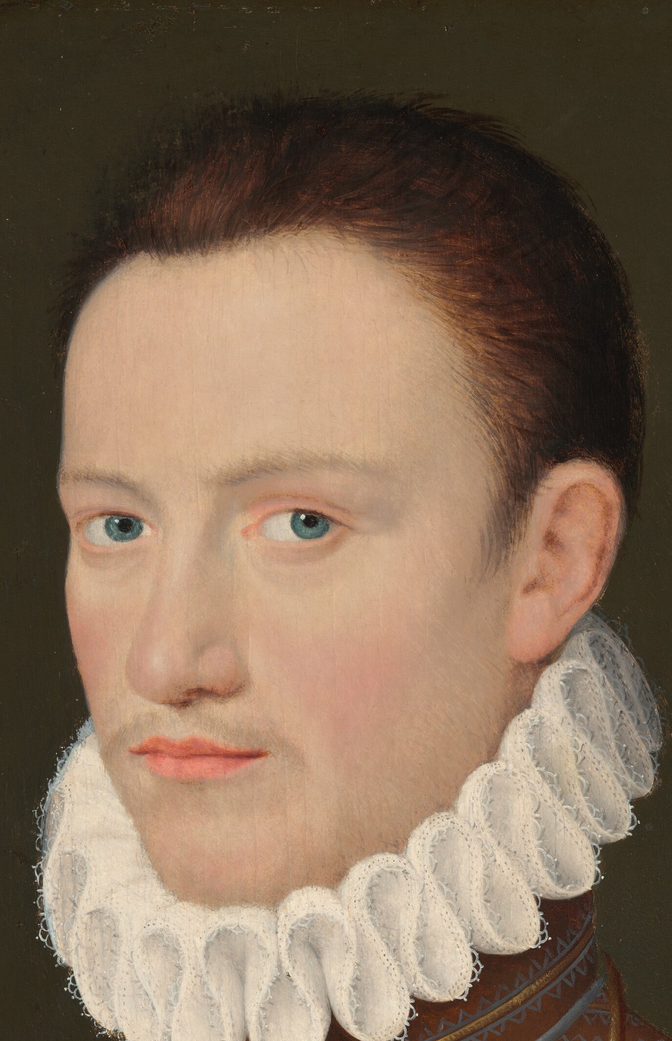 Young, androgynous face with a subtle downward gaze and faintly pursed lips, the sitter's psychology is readable despite the formal posture