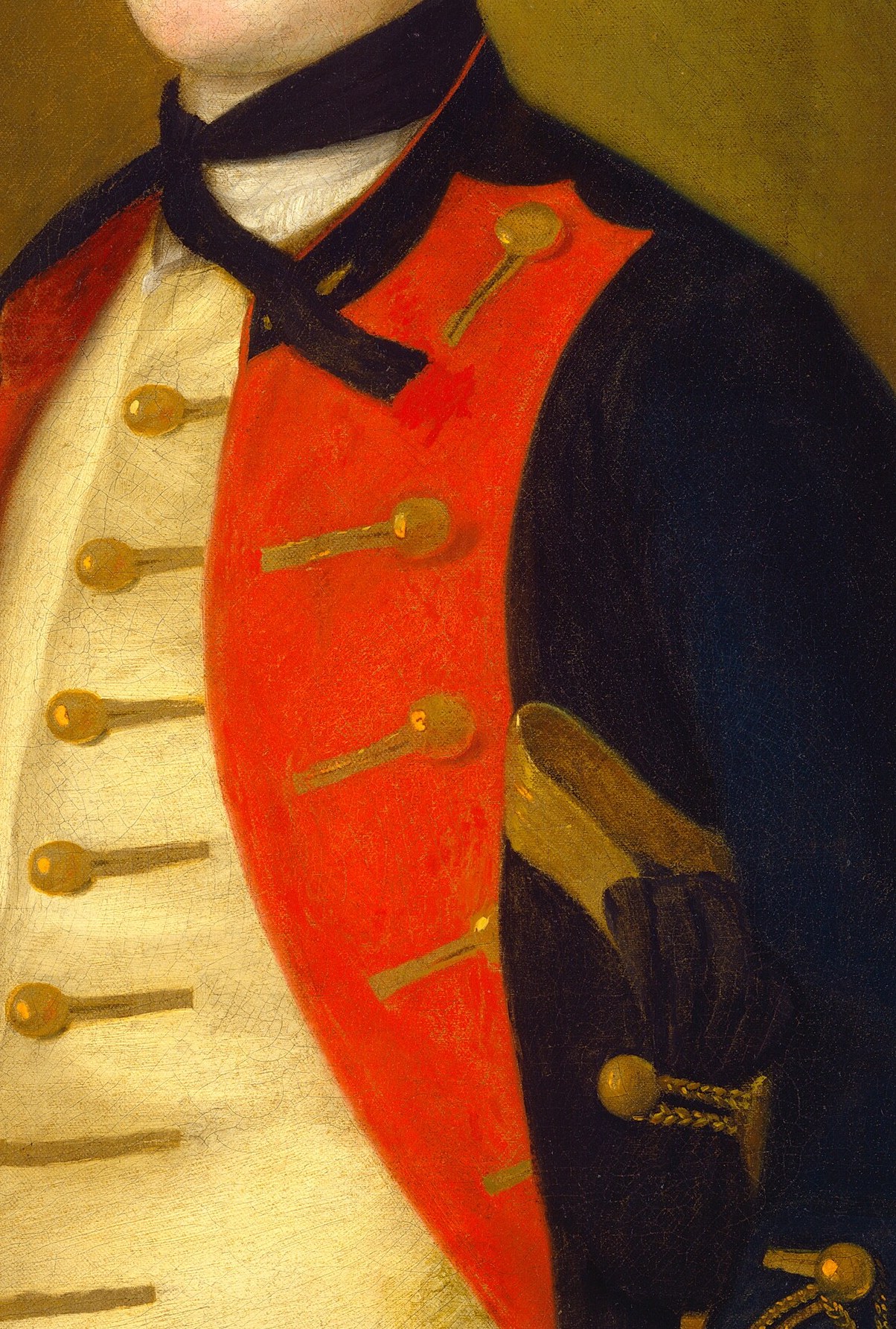 His red uniform jacket is meticulously detailed, a badge of rank.