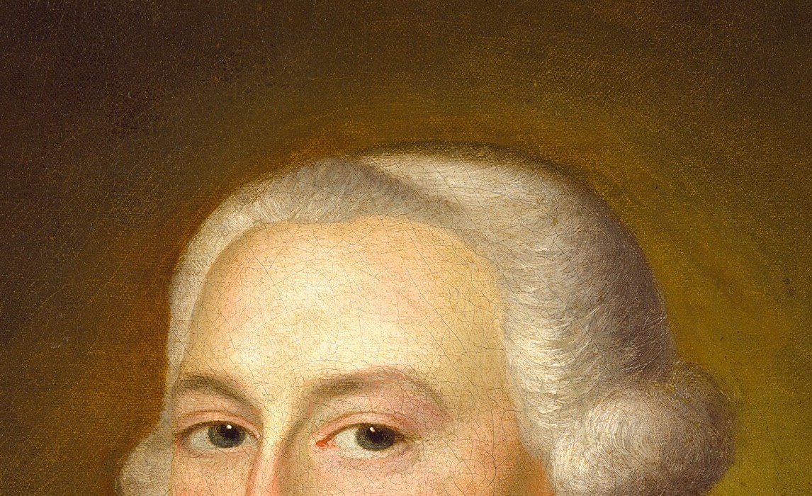 His powdered wig, a sign of status, frames a composed face.