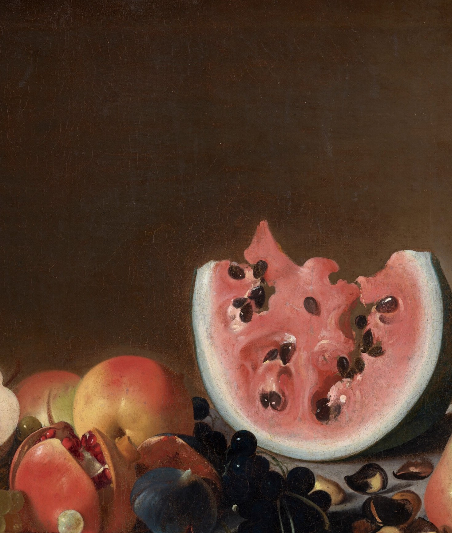 The cut watermelon, its seeds exposed, points to abundance and fertility.
