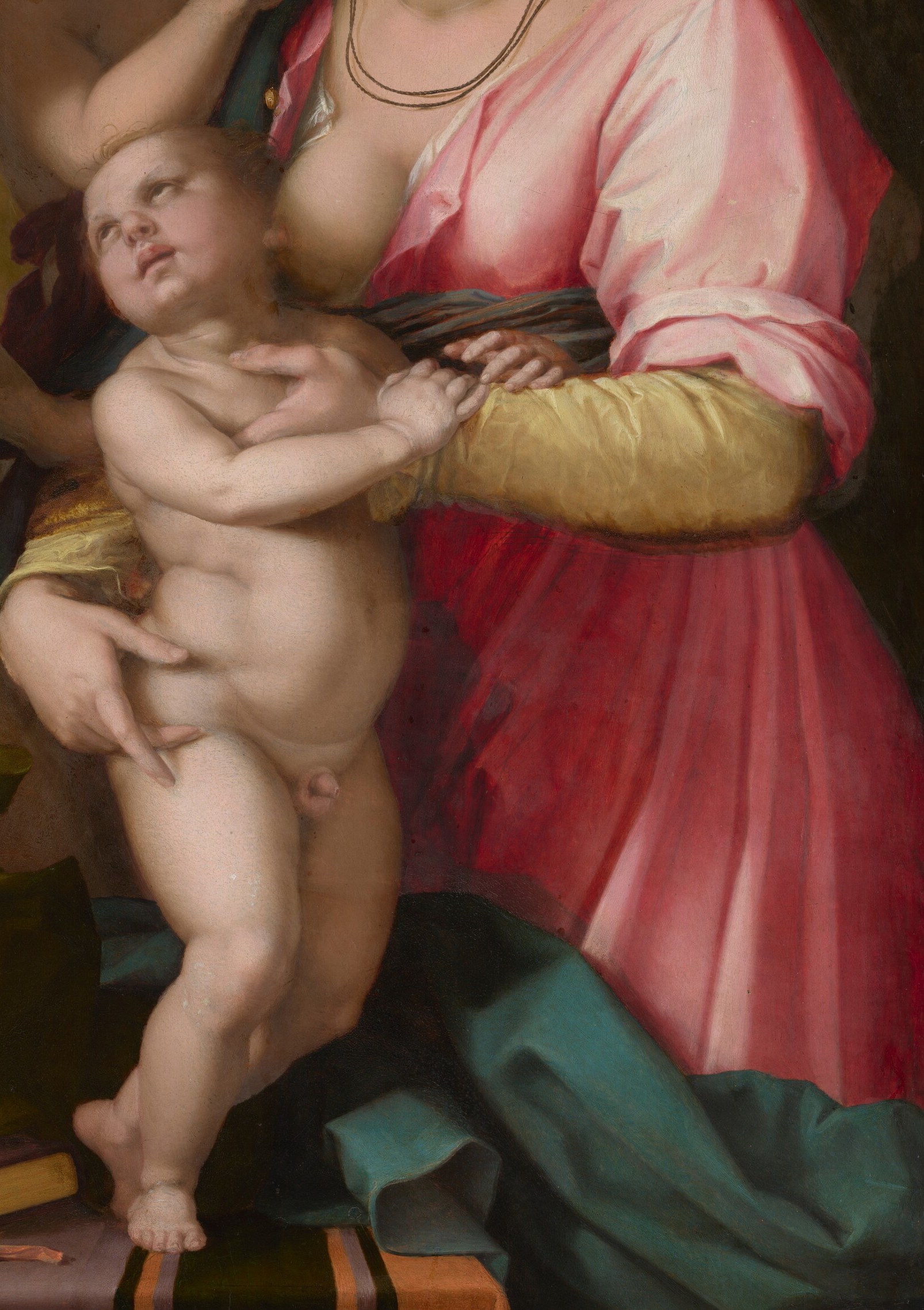 The central figure embraces an infant and another child.