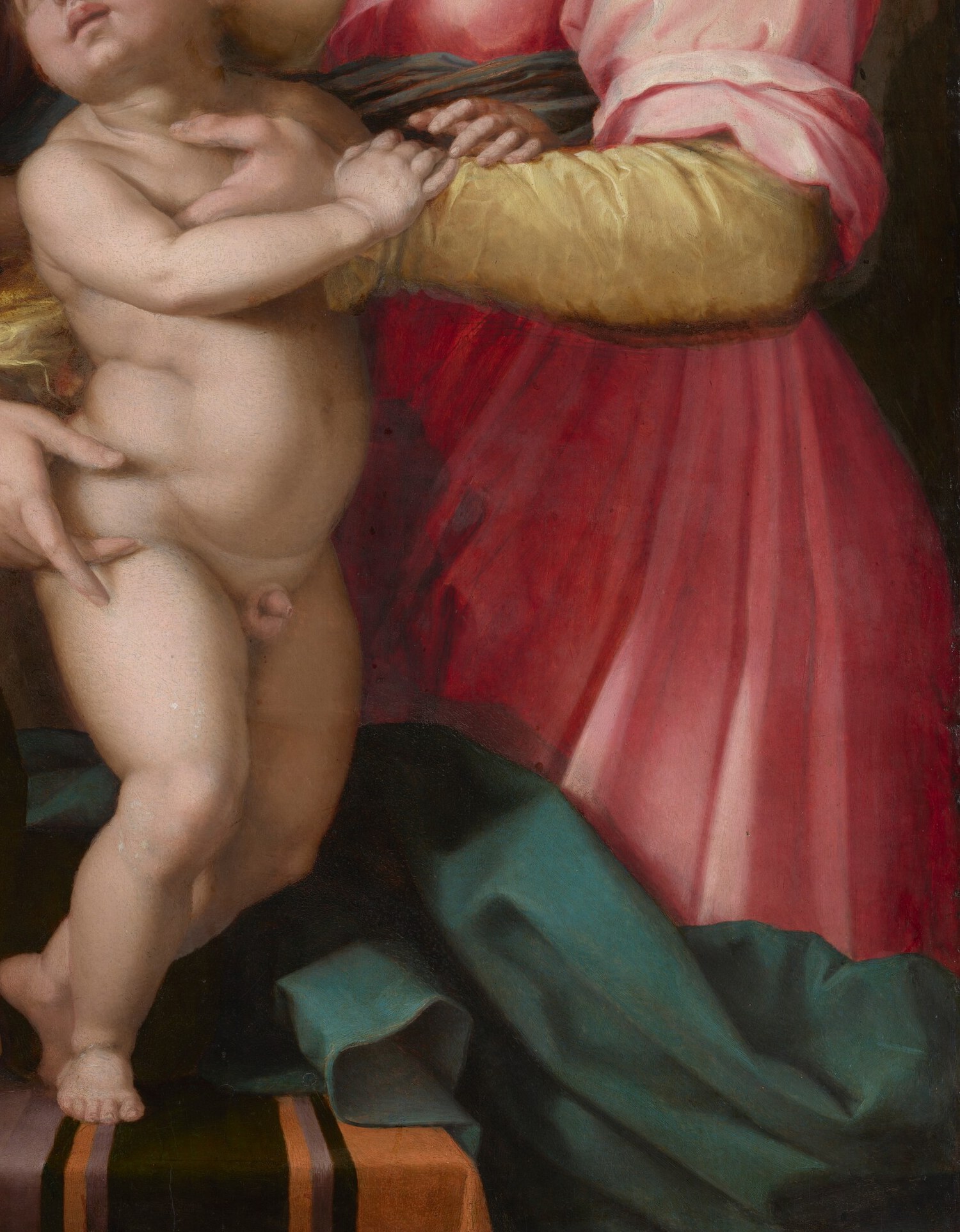 Her pink robe signifies warmth and abundance.