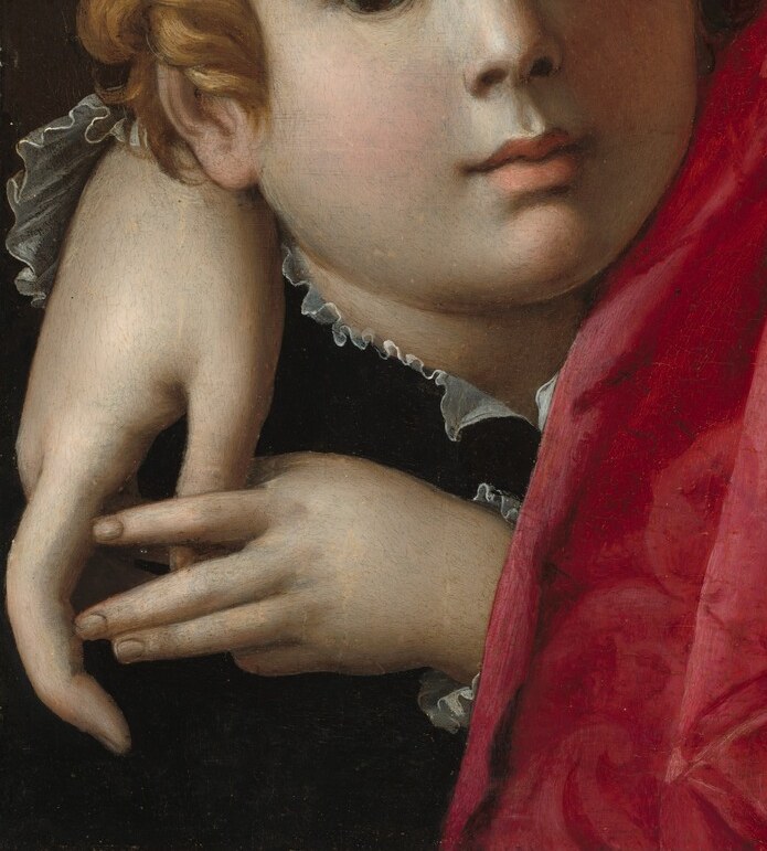 Even her son's simple garment has a fine ruffled collar.