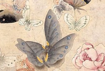 Here, a large blue butterfly with spotted wings takes center stage.