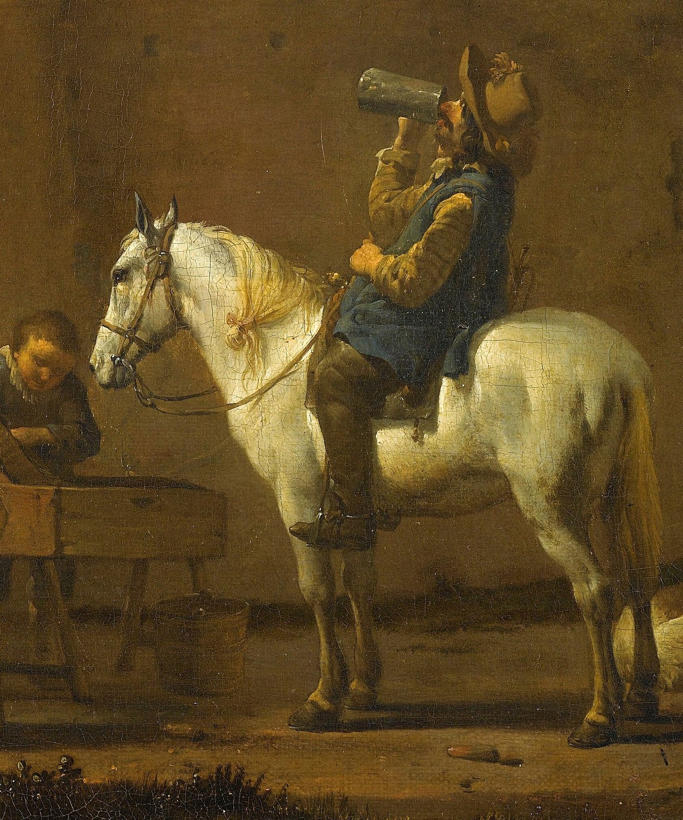 His white horse stands patiently beside him.