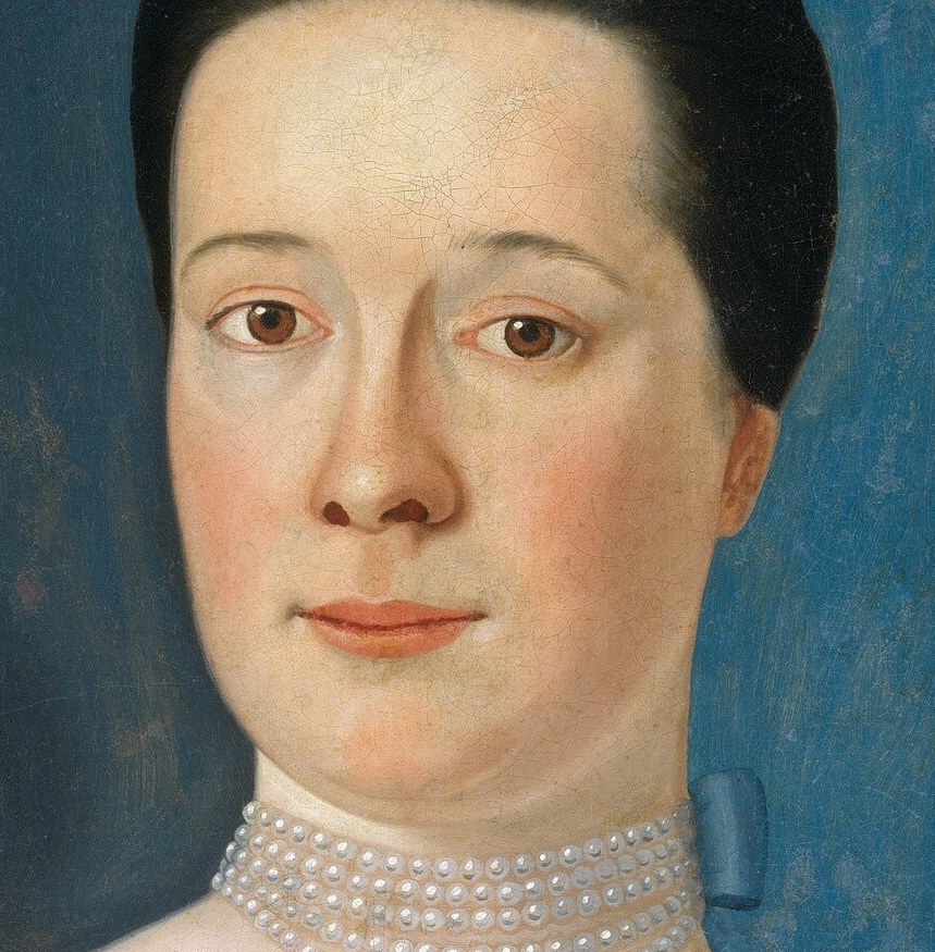 Her direct gaze invites a personal connection.
