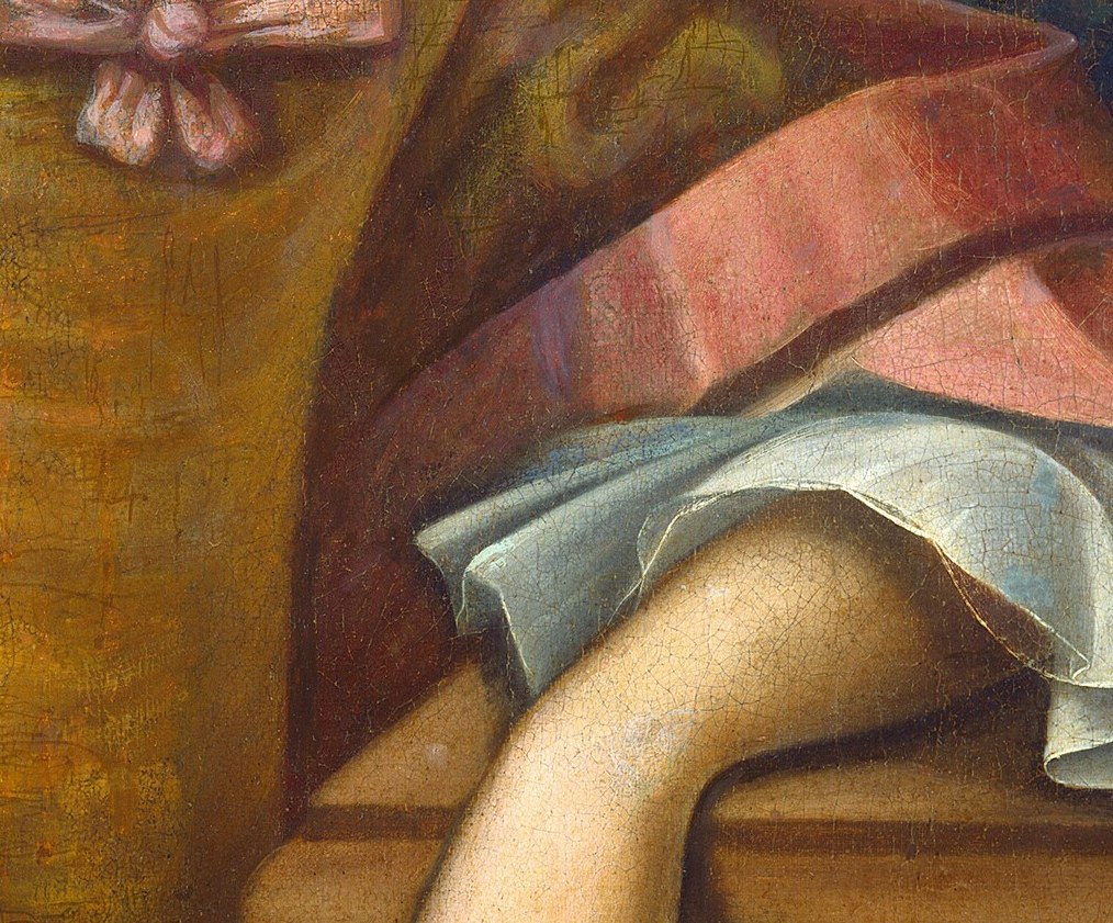 Crisp white lace cuffs peaking from the golden gown sleeve signal costly imported textile and refined gentility , a social cipher the 18th-century viewer would read instantly.