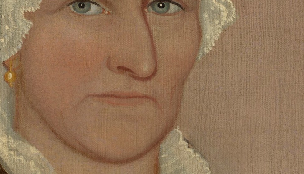 Her firmly closed mouth suggests a woman of quiet strength.