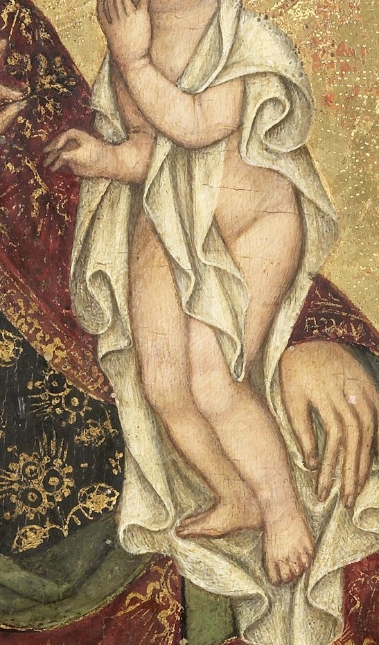 The simple white diaper on the child emphasizes his purity.