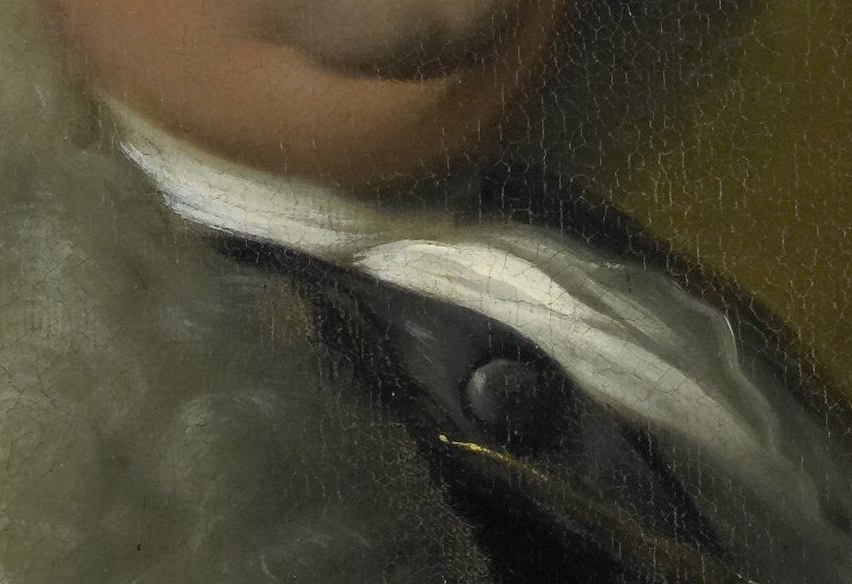 The fur collar on his coat shows his wealth and importance.