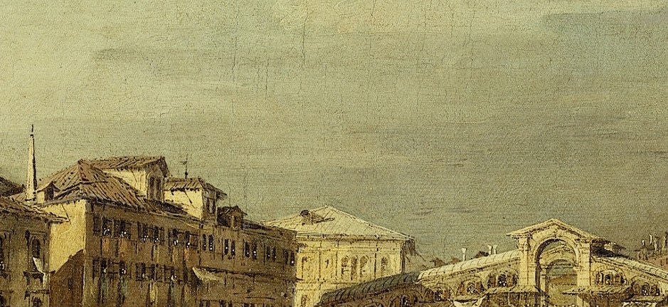 The iconic Rialto Bridge frames the scene.