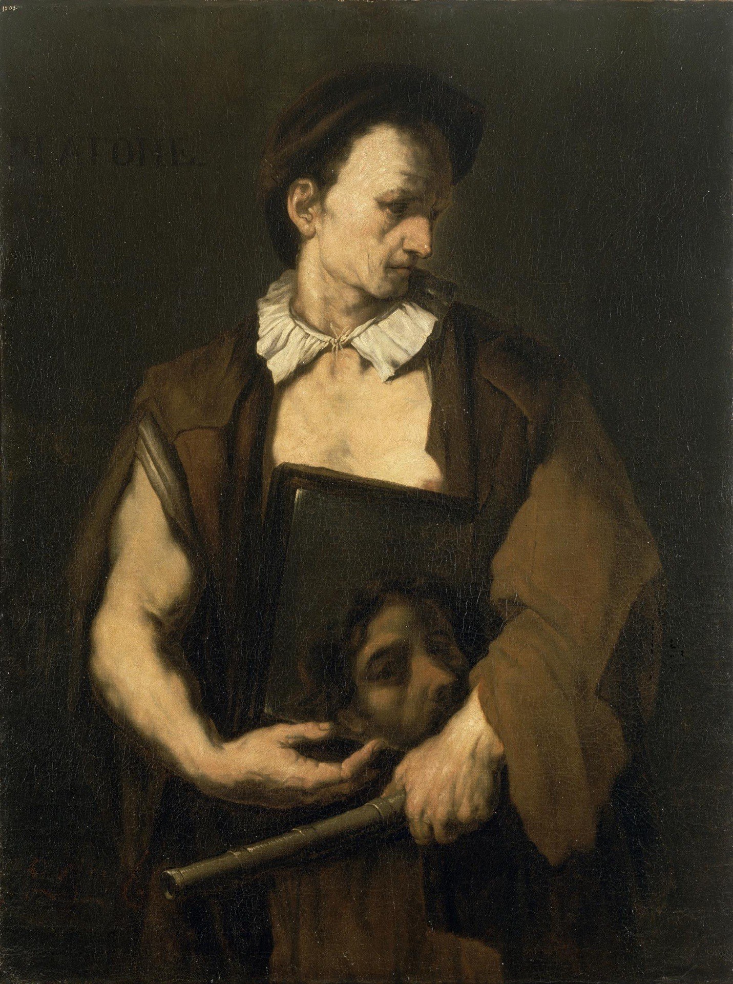 The deep shadows emphasize the illuminated figure, creating a dramatic and intimate atmosphere.