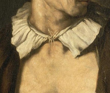 The crisp white fabric contrasts with the dark clothing, drawing attention to the neck and face.